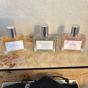 Set of Three Perfume Bottles with Silver Caps